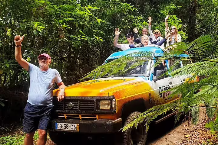 Adventurers enjoy a thrilling 4WD tour through lush greenery on the Cabo Girão Sea Cliff and Mountains experience.
