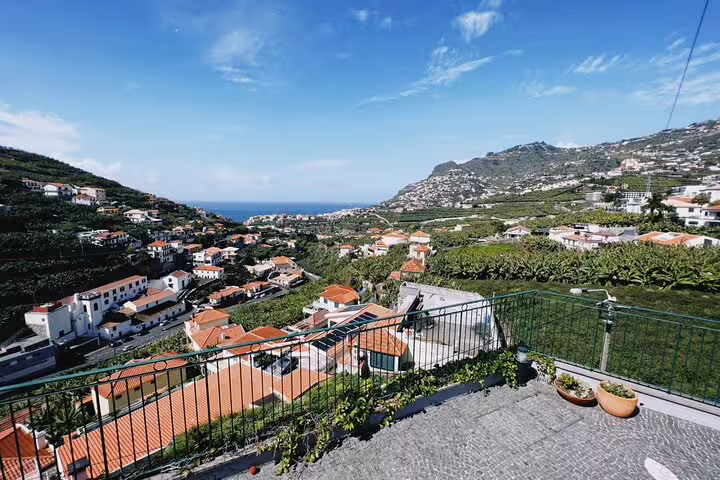Panoramic view from Cabo Girão showcasing lush landscapes and ocean vistas on the e-bike road tour to Funchal.