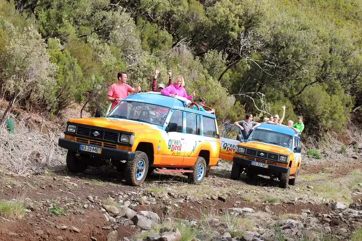 Adventure seekers enjoy an exciting 4x4 ride through lush landscapes on the Cabo Girão Skywalk tour in Madeira.