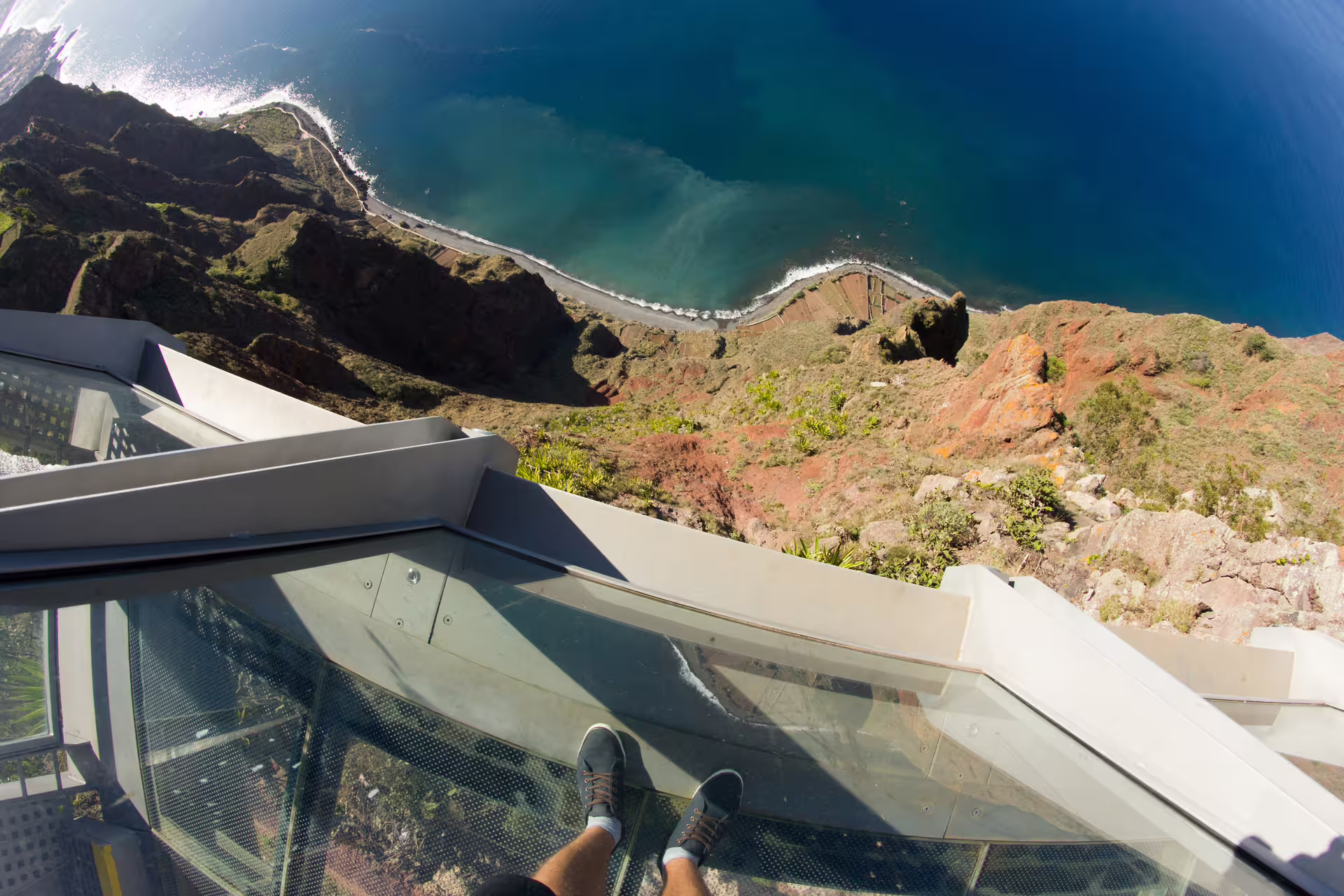 View from Cabo Girão skywalk showcasing breathtaking ocean cliffs on a full-day tour with pickup in Madeira.