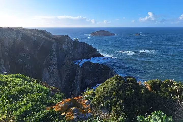 Stunning coastal cliffs at Cabo Peñas with panoramic ocean views, a breathtaking stop on the tour from Oviedo.