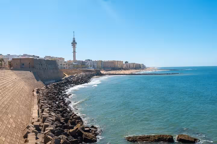 Scenic view of Cadiz coastline with Torre Tavira in the distance during a private city walk.