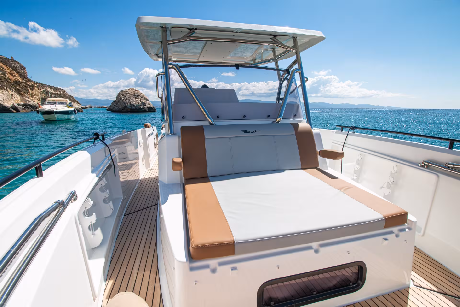 Luxurious boat deck on turquoise waters during Cagliari 3-hour tour, highlighting comfort and scenic views.