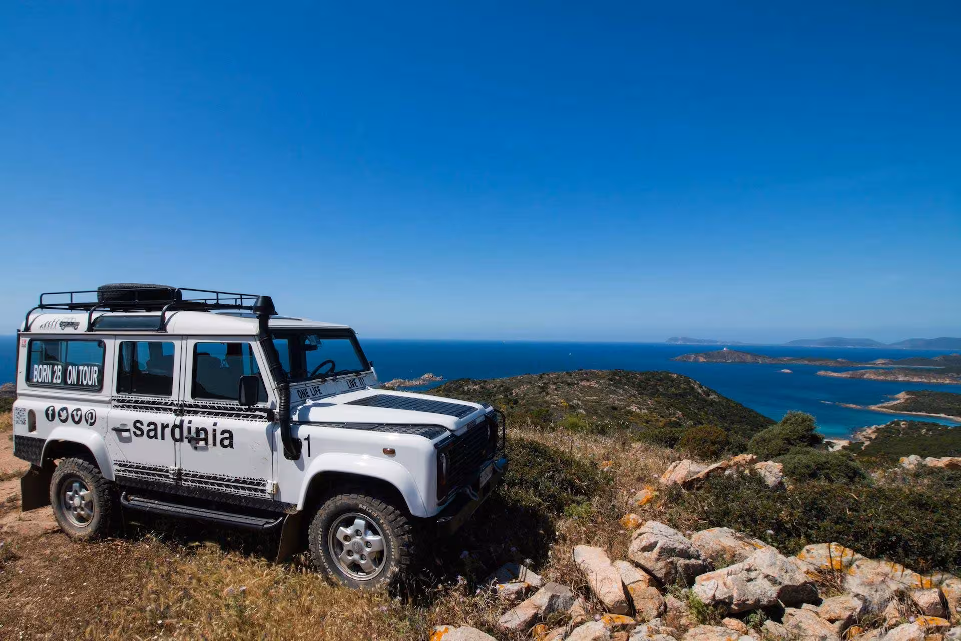Explore the Sardinian coastline with a jeep on a scenic tour from Cagliari to Chia, showcasing stunning sea views.