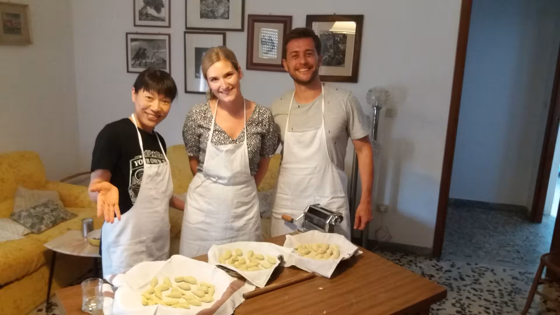Participants proudly display their handmade culurgiones during a Cagliari cooking class with lunch included.