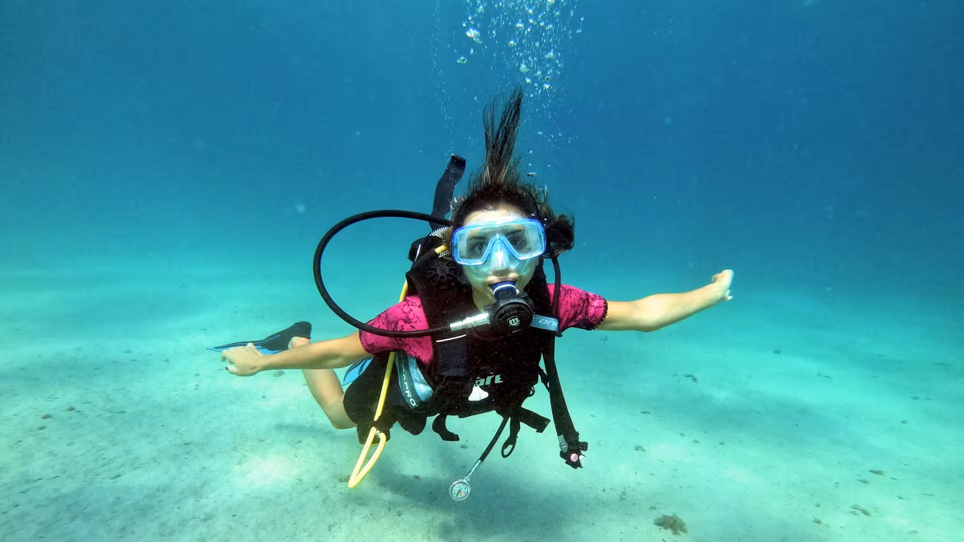 Diver enjoying a serene underwater experience in the clear waters of the Gulf of Angels, Cagliari.