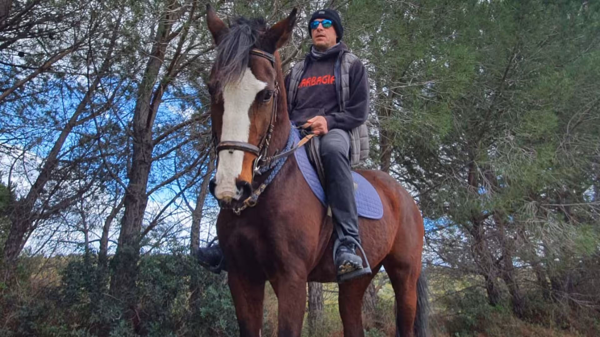 Rider on a horse exploring the lush trails of Cagliari's panoramic horseback riding tour.