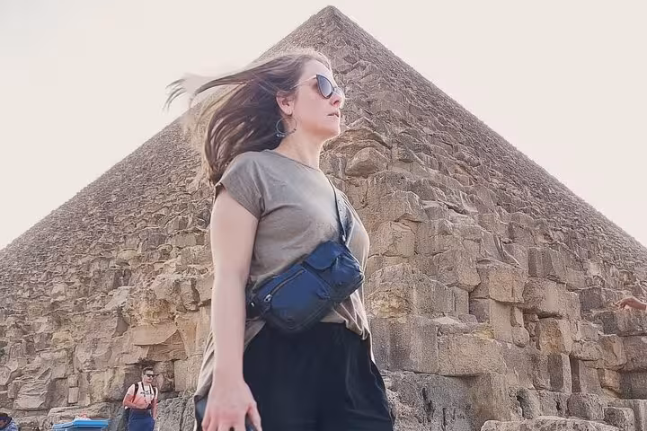 Traveler at the Great Pyramid of Giza on Cairo 2-day tour, Pyramids and Egyptian Museum highlights