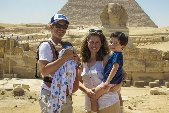 Family at Giza Pyramids and Great Sphinx on Cairo 3-day highlights tour, top Egypt sightseeing experience