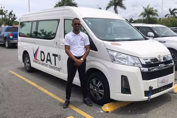 Professional driver beside private transfer minivan for Cairo Airport pickup, safe door-to-door hotel transport