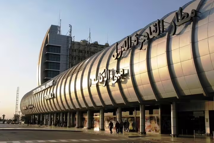 Exterior of Cairo International Airport Terminal with signage, ideal for private Cairo airport transfer pickup