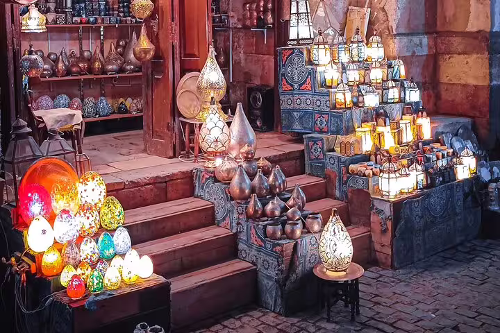 Colorful handmade lanterns and brassware in Cairo bazaar stop on full-day Alexandria to Cairo private car tour