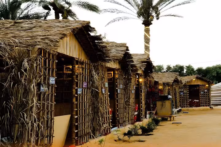 Rustic Bedouin huts in Giza desert camp for VIP Arabian Night dinner and show, ideal for free photographer shots