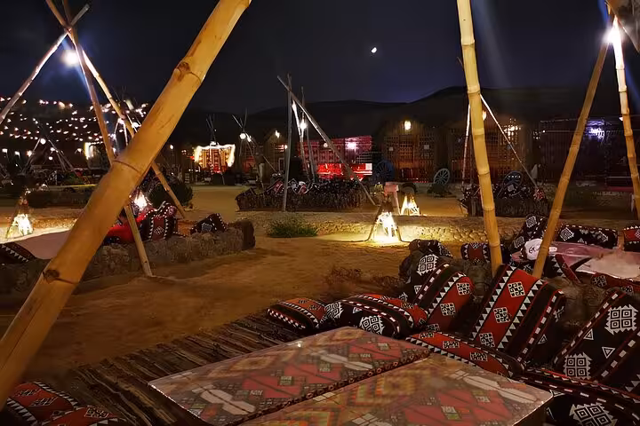 Bedouin-style desert lounge in Giza at night, VIP Arabian Night dinner and show with cozy seating