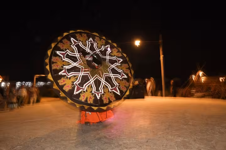 Whirling tanoura performance at night in Giza desert camp for VIP Arabian Night Bedouin dinner and show tour