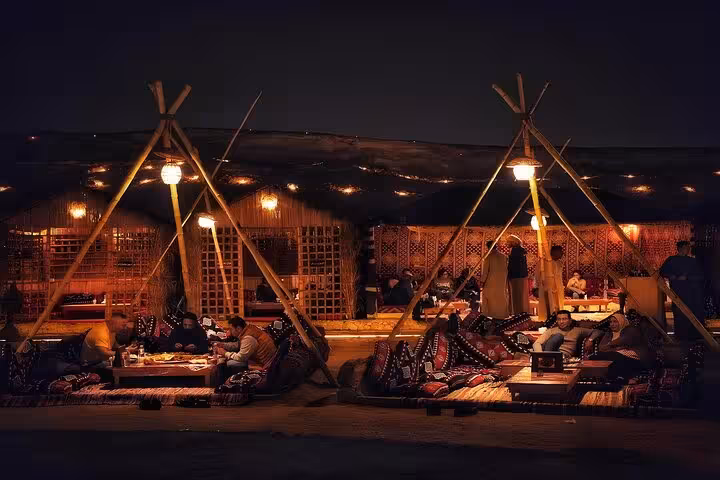 Guests relaxing in a Bedouin tent in Giza, VIP Arabian Night dinner and live show with free photographer