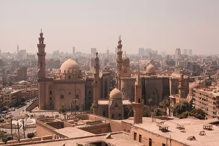 Panoramic view from Cairo Citadel with historic mosques and skyline, key stop on National Museum to bazaars tour