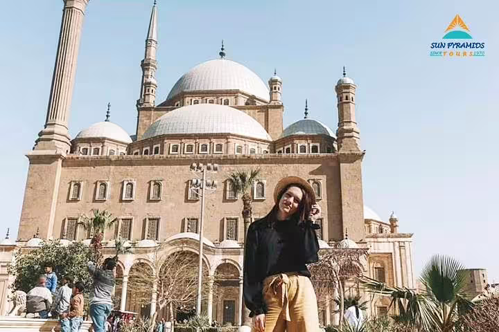 Traveler posing at Mohamed Ali Mosque in Cairo Citadel, key stop on a 5-day Cairo short break