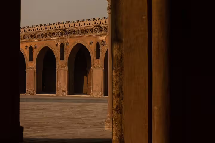 Sunlit arches inside Cairo Citadel mosque courtyard, a highlight on Giza Pyramids and Old Cairo day tour