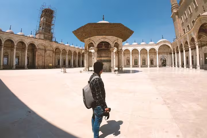 Traveler in the Mosque of Muhammad Ali courtyard at Cairo Citadel, key sight on a 2-day Cairo short break