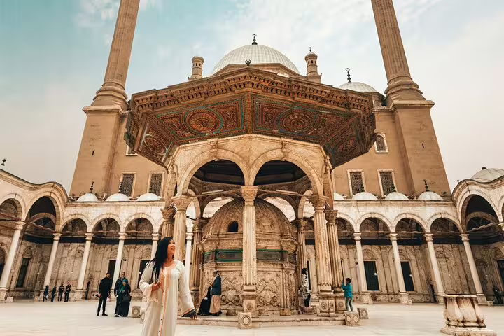 Traveler in courtyard of Cairo Citadel Mosque of Muhammad Ali, a highlight on Giza and Old Cairo day tour