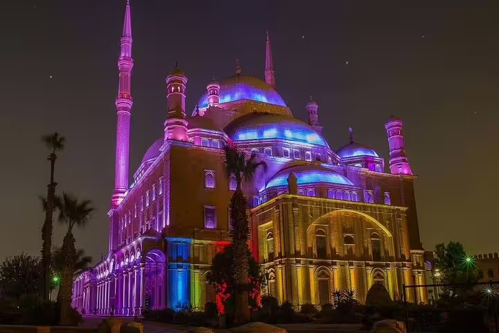 Cairo Citadel Mosque illuminated at night, stop on From National Museum to Citadel & Bazaars guided tour