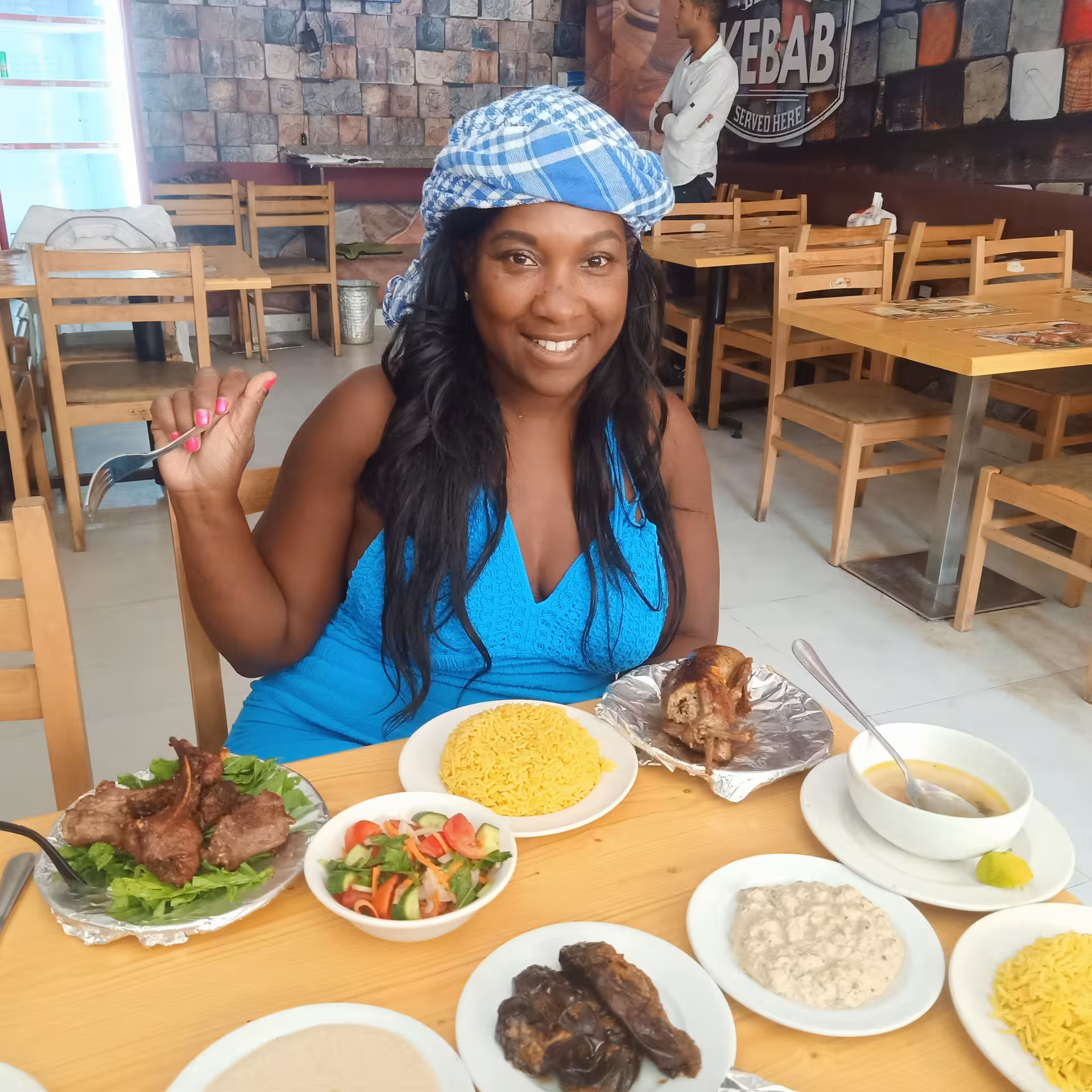 Guest enjoying Egyptian kebab, rice and mezze at a local Cairo restaurant on a private Cairo food tour
