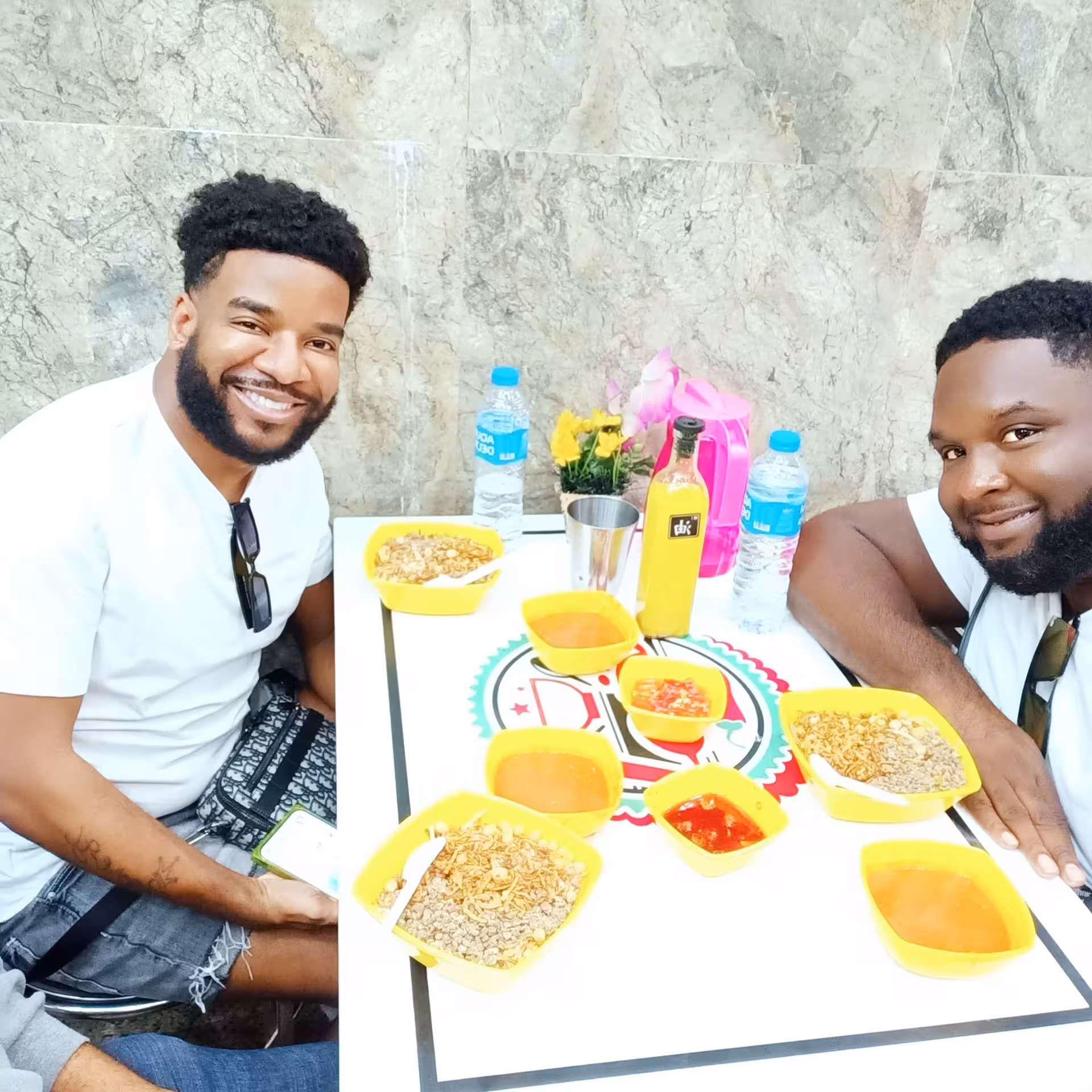 Friends dining on koshari and sauces at a local Cairo spot during a private Cairo food tour and walking experience