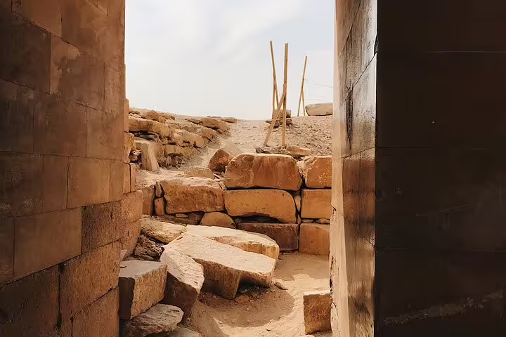 Stone passageway and ancient ruins at Giza Plateau near the pyramids, featured in a 2-day Cairo city break