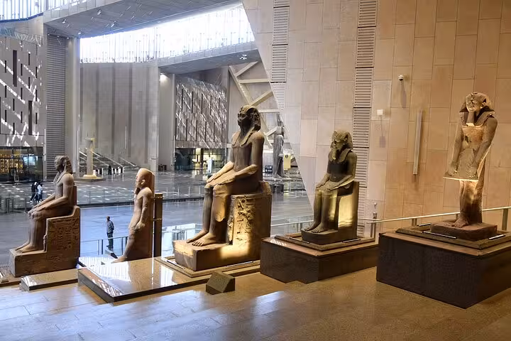 Grand Egyptian Museum gallery with ancient pharaoh statues, a top stop on Cairo highlights tour