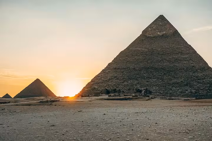 Sunset view of the Great Pyramid of Giza on Cairo highlights tour, pyramids and museum with optional Nile cruise