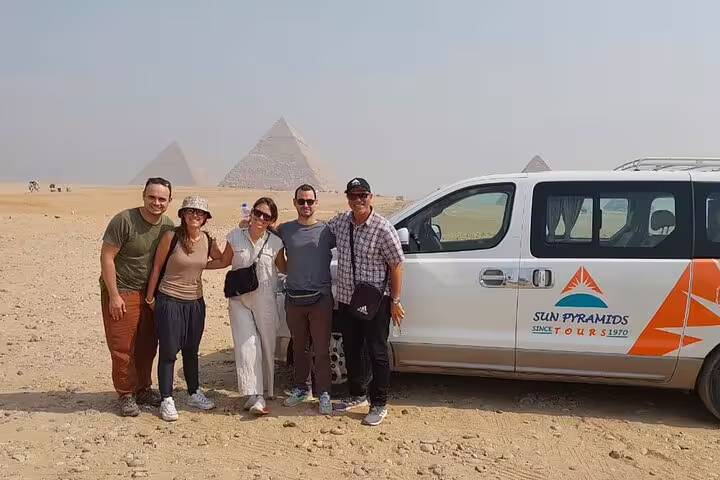 Tourists with private van at Giza Pyramids on Cairo layover tour to Memphis, Saqqara and Dahshur