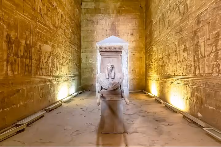Carved temple corridor with sphinx statue, ancient Egypt sightseeing on 7-day Cairo Luxor Aswan tour