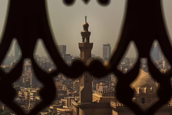Cairo skyline view from Mohamed Ali Mosque, highlighting minaret and historic Islamic architecture on private tour