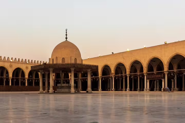 Wide courtyard with domed ablution fountain and arcades in Cairo mosque, Citadel and Bazaar tour