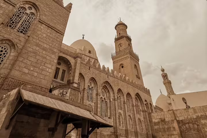 Historic Cairo mosque exterior with domes and minarets, Islamic architecture on Old Cairo mosques tour