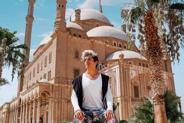 Traveler at Cairo’s Mosque of Muhammad Ali near the Citadel, a highlight of the museum to bazaars tour