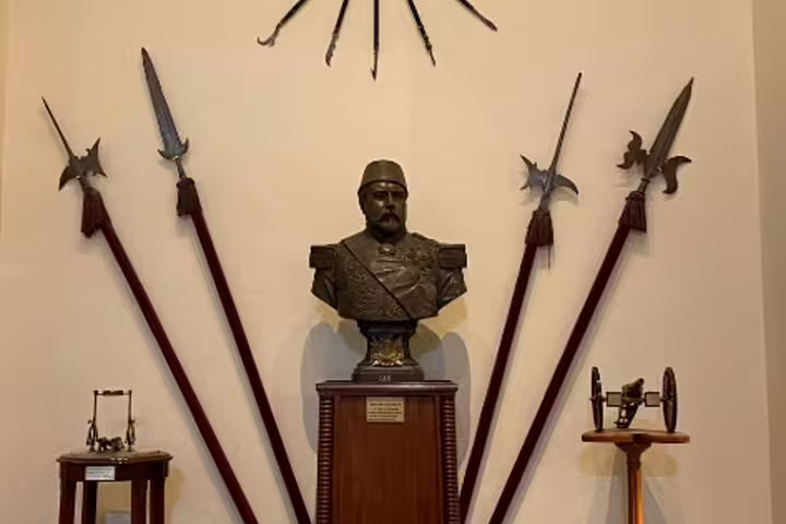 Historic weapons display and bust in Cairo museum, part of Cairo by night tour with El Fishawy Cafe visit