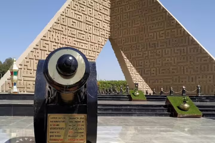 Cannon monument at Unknown Soldier Memorial in Cairo, night tour landmark visit before ElFishawy Cafe and El Azhar Park