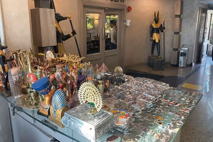 Egyptian souvenirs and pharaonic decor at Cairo Nile dinner cruise lobby before belly dancing show