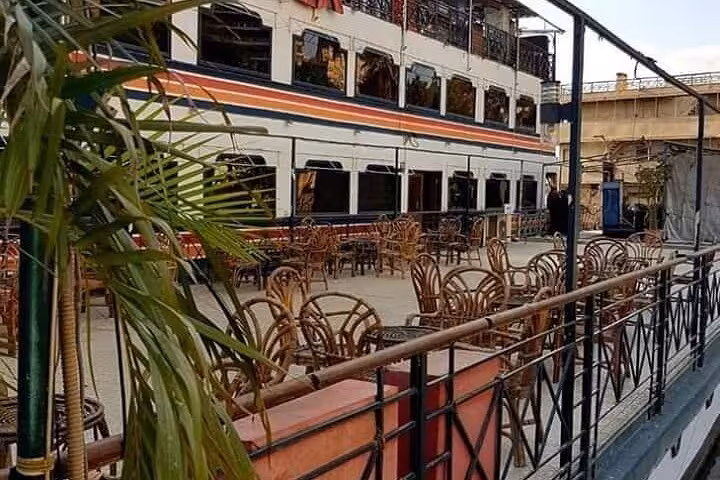 Open-air deck seating on a Cairo Nile dinner cruise boat, perfect for dinner, belly dancing and folklore show