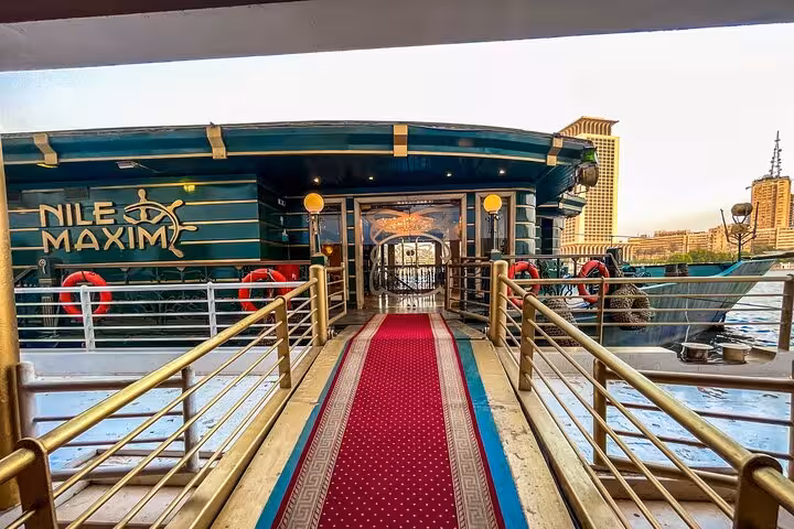 Red carpet boarding ramp to Nile Maxim boat for Cairo Nile dinner cruise with belly dancer and Tanoura show