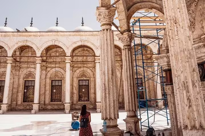 Traveler in courtyard of Cairo’s Mosque of Muhammad Ali on a 2-day private guided Cairo tour