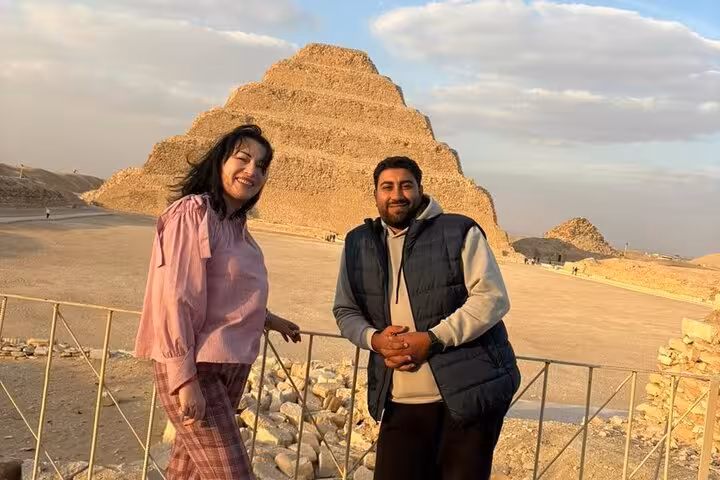 Guests with Egyptologist guide at Saqqara Step Pyramid on private Cairo day tour to Giza, Sphinx and Memphis