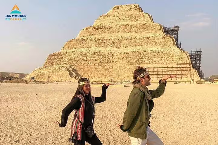 Travelers pose by the Step Pyramid of Djoser in Saqqara on a 5-day Cairo short break tour in Egypt
