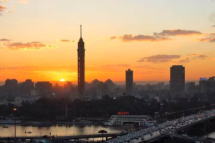 Cairo skyline at sunset by the Nile on the Sharm El Sheikh to Pyramids full-day bus tour with lunch