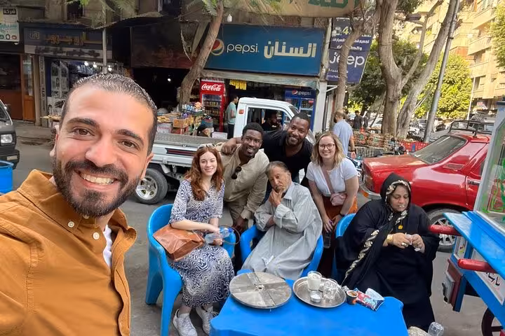 Cairo street café stop with local tea and tour guide, showcasing authentic culture and cuisine in downtown Cairo