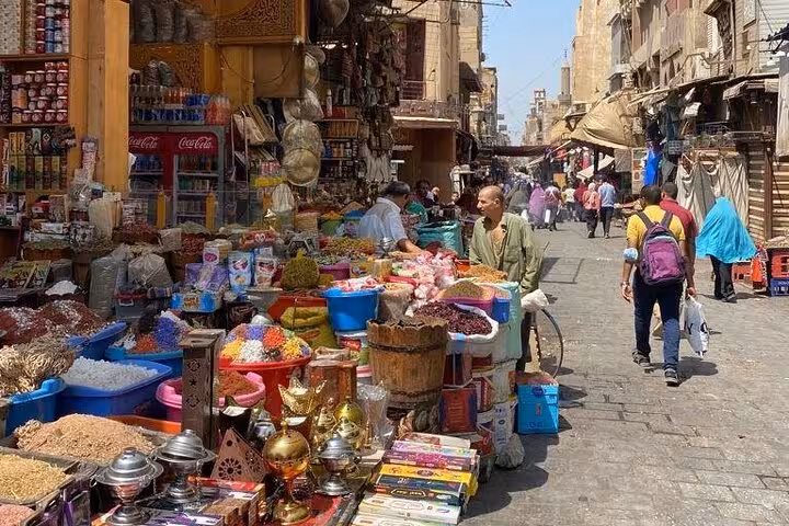 Cairo street market stalls with spices, nuts and tea essentials on an Egyptian food and tea tour