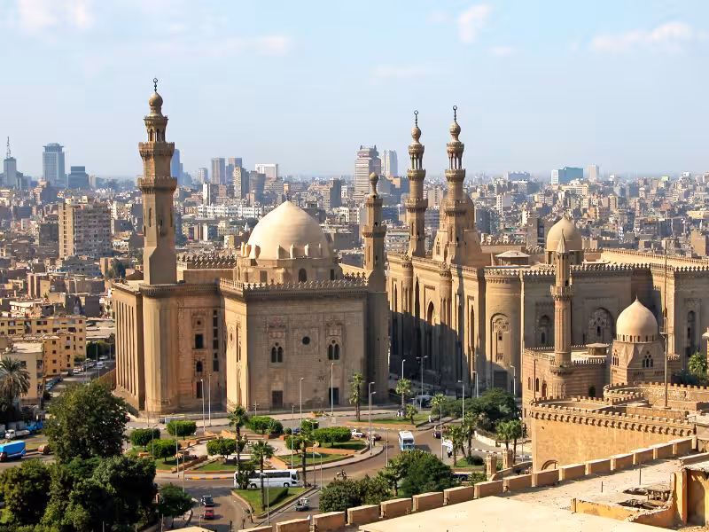 Cairo skyline view of Sultan Hassan Mosque and Al-Rifa’i, a highlight on Wonders of the Pharaohs tour
