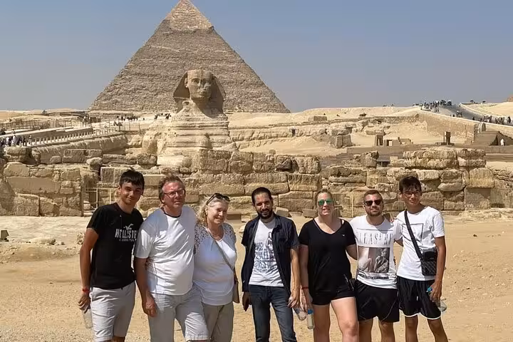 Tour group by the Great Sphinx and Khafre Pyramid at Giza, on Cairo 2-day tour with Citadel and Coptic Cairo